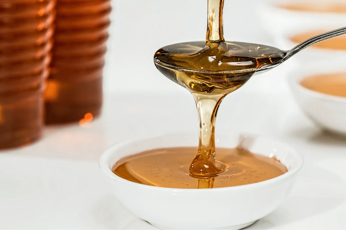 Teaspoons in a Cup with honey